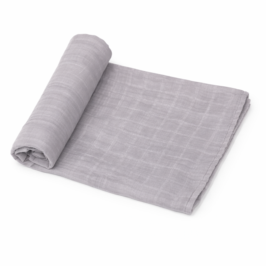 medium gray organic muslin baby swaddle blanket rolled on white background