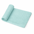 Load image into Gallery viewer, airy blue organic muslin baby swaddle blanket rolled on white background
