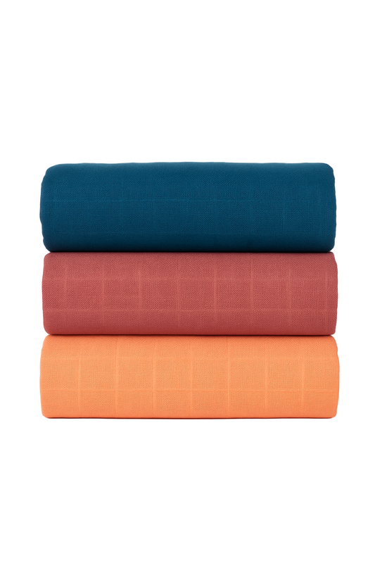 Set of three muslin swaddle blankets (3pack) in teal, rose red, and amber